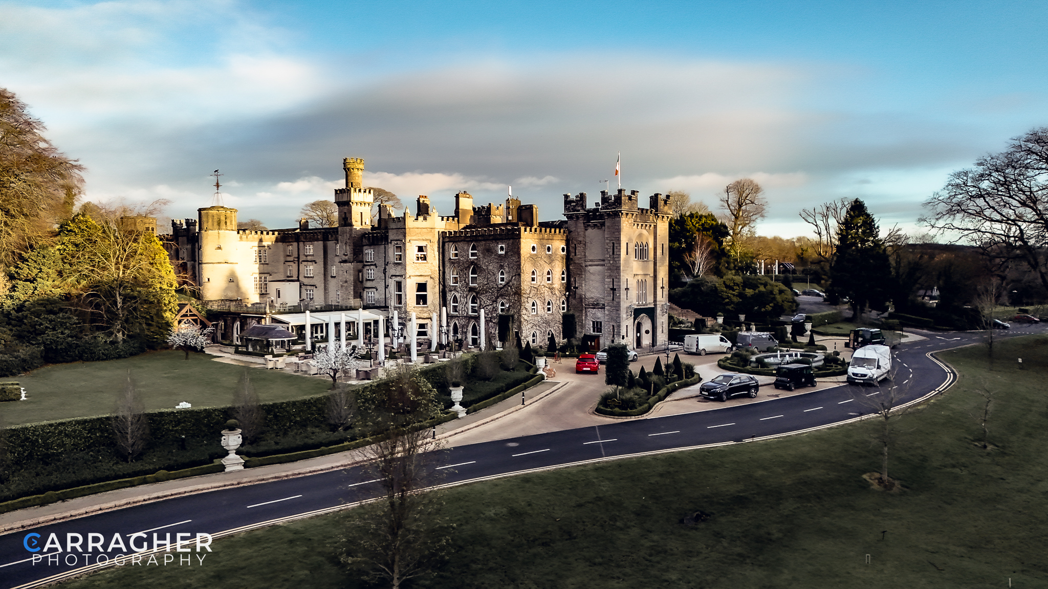 Drone photograph of Cabra Castle in County Cavan, Ireland, showcasing the historic castle, landscaped grounds and surrounding countryside