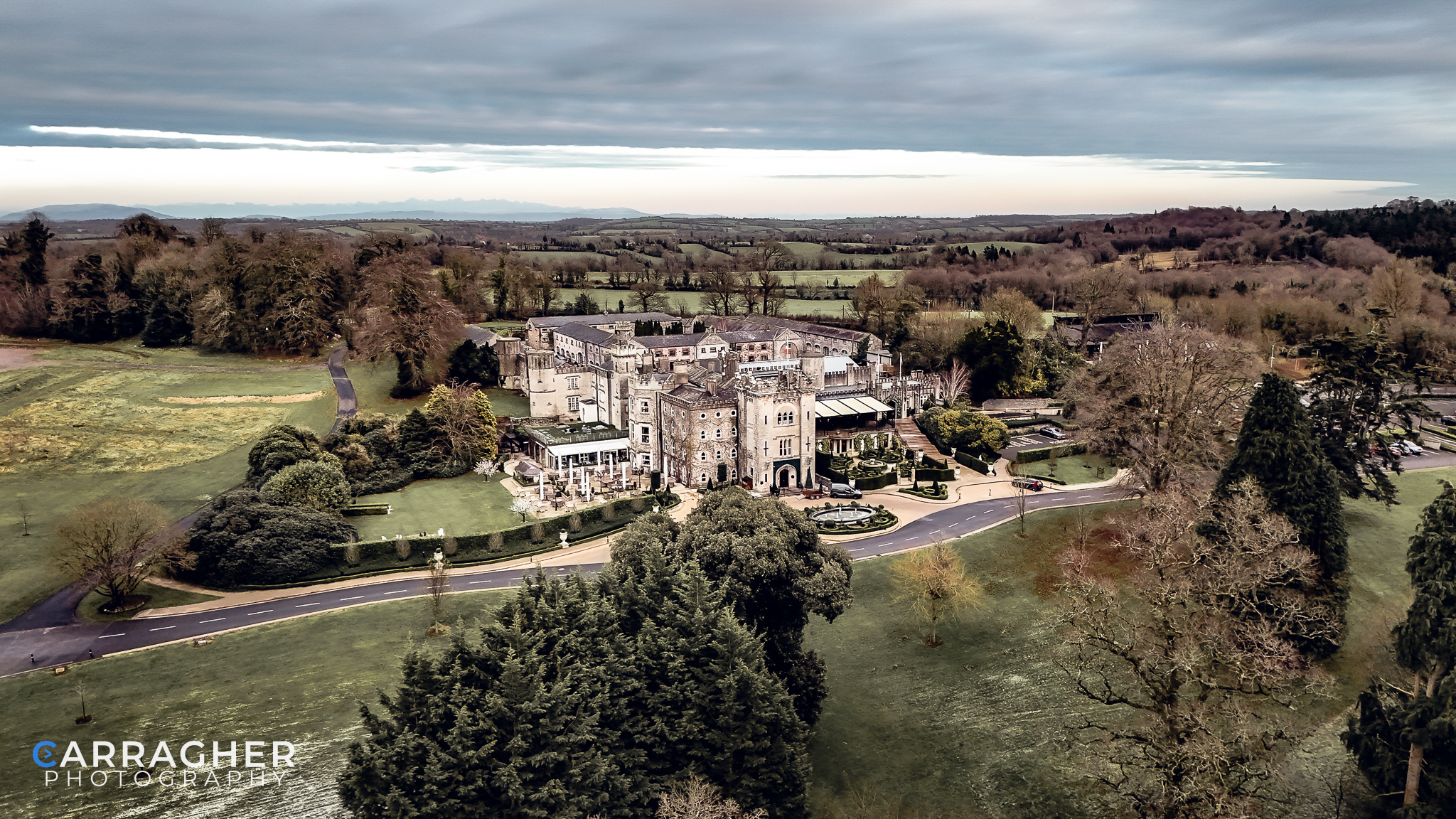 Drone photograph of Cabra Castle in County Cavan, Ireland, showcasing the historic castle, landscaped grounds and surrounding countryside
