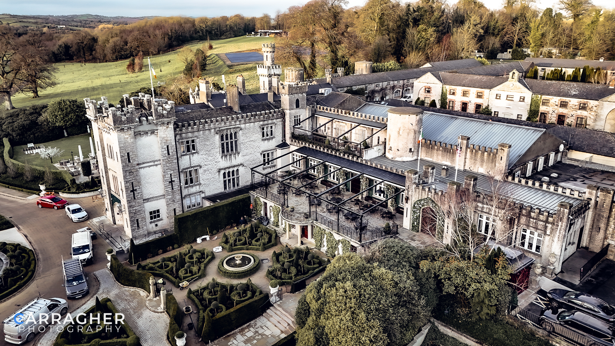 Drone photograph of Cabra Castle in County Cavan, Ireland, showcasing the historic castle, landscaped grounds and surrounding countryside